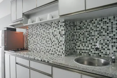 Kitchen with professional tiling and splashback